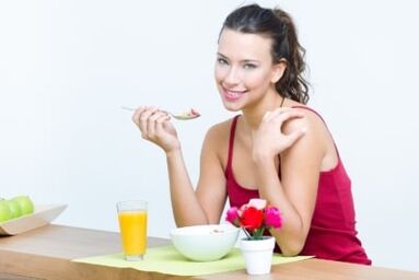 The girl is eating salad